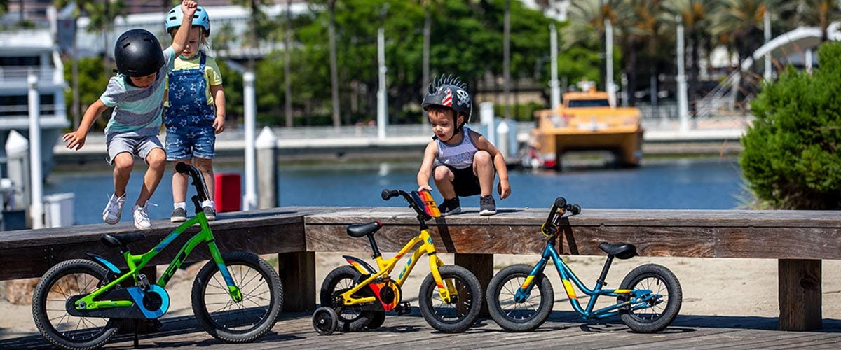 Kids riding 12 inch GT bike and GT balance bikes