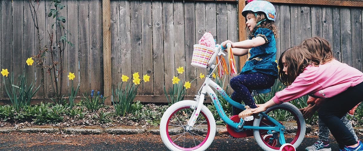 Parents Teaching Kids To Ride Bike