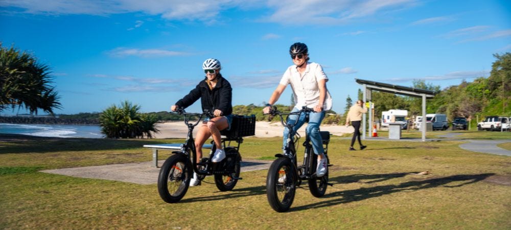 Couple riding two pedal Brewer Cargo