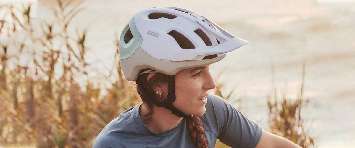 Woman wearing mountain bike helmet