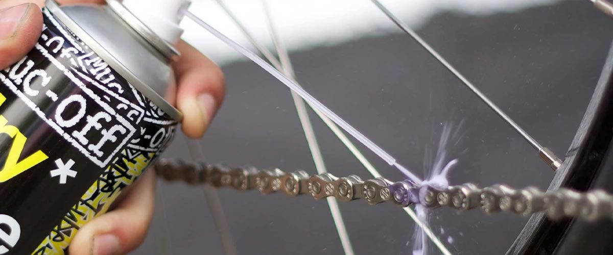 Bike Chain being lubricated with spray lubricant