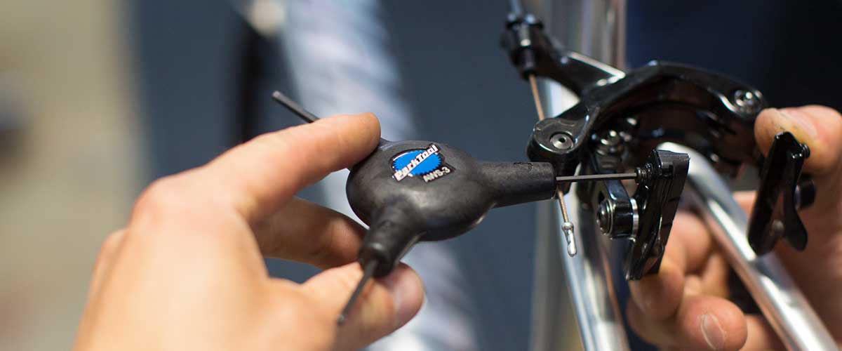 Allen key removing brake pads from bike